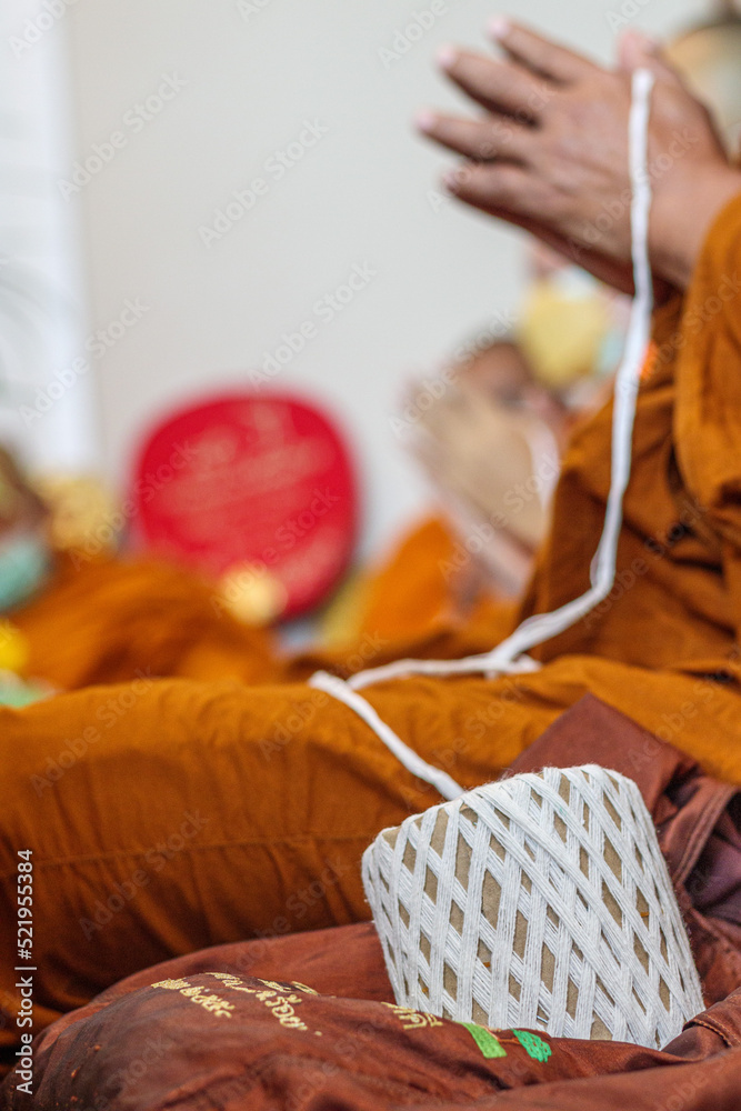 The thread is part of a religious ritual that will connect the people ...