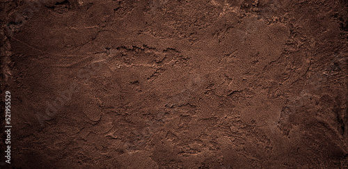Fotografia Dark chocolate brown sugar-like grainy texture background