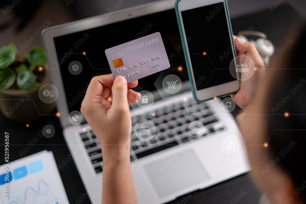 Close up shot of females hands holding credit card tand smart phone with technology icons. Close up shot of females hands holding credit card tand smart phone with technology icons.