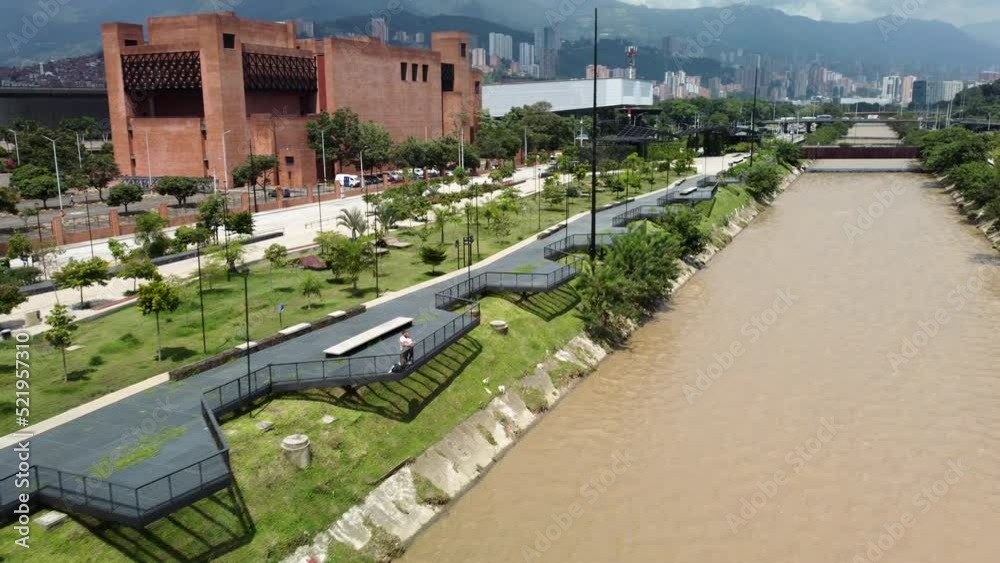 Aerial View of river park (Parques Del Rio) in downtown Medellin Colombia with building in the background Aerial View of river park (Parques Del Rio) in downtown Medellin Colombia with building in the background