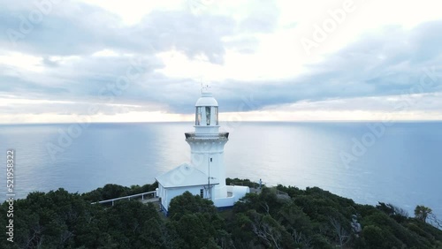 Scenic aerial panorama of the Smoky Cape Lighthouse located on a narrow coastal headland. photo