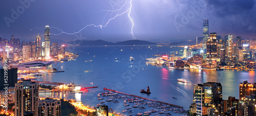 Hong Kong night view with storm and lighting bolts