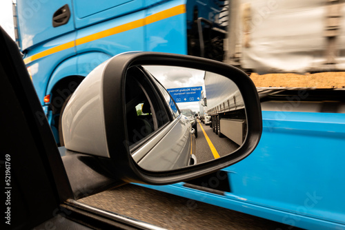 Traffic jam reflecting in side-view mirror photo
