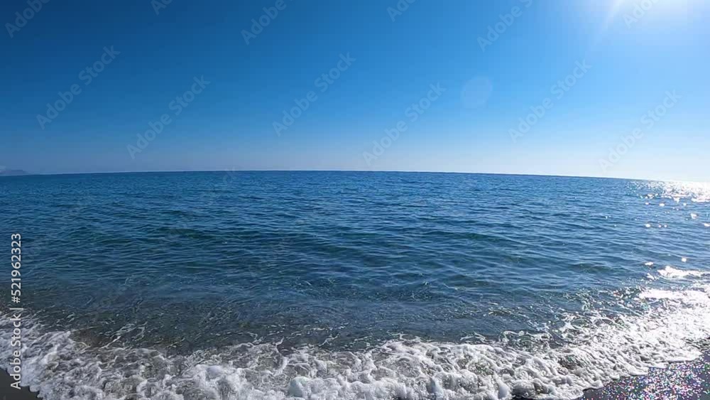 POV of running into the water at the beach in slow motion POV of running into the water at the beach in slow motion
