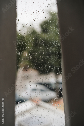 Curtains by window on rainy day at home