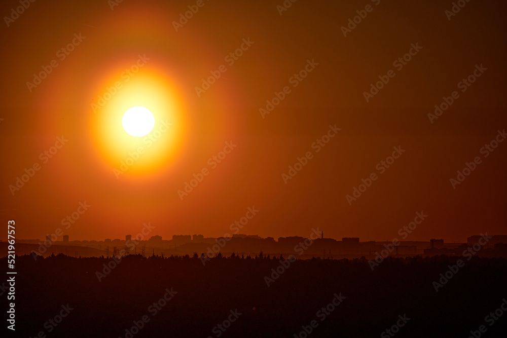 Evening sky with setting sun through clouds at sunset, cloudy landscape Evening sky with setting sun through clouds at sunset, cloudy landscape