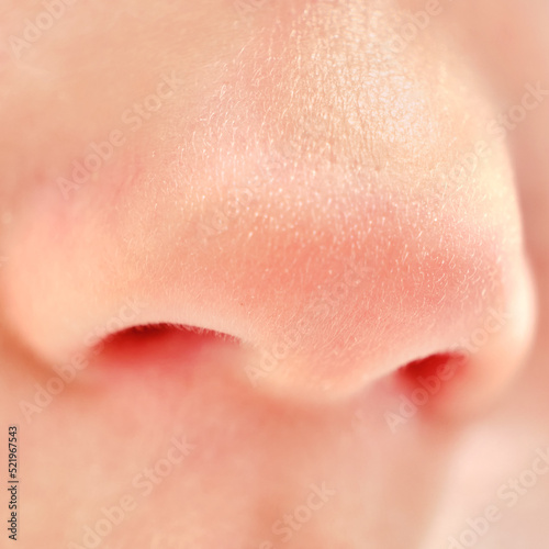 Close-up of baby nose age one year, macro photo of the child face