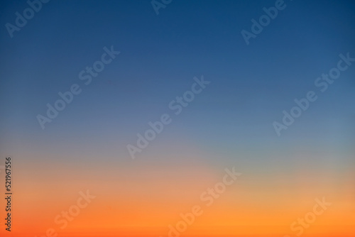 Orange and blue sunset sky gradient, copy space background. Red evening sky without clouds © Андрей Журавлев