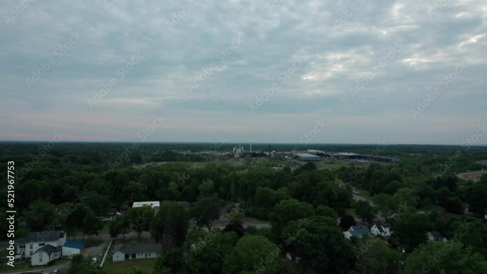 Drone captured overhead view of the Old Lumber mill in the overcast sky Drone captured overhead view of the Old Lumber mill in the overcast sky