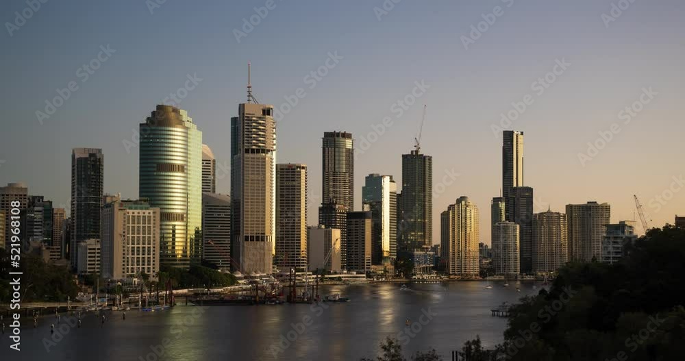 Sunrise timelapse of Brisbane CBD skyline. Calm and clear day with colorful sky (view from Kangaroo Point). Sunrise timelapse of Brisbane CBD skyline. Calm and clear day with colorful sky (view from Kangaroo Point).
