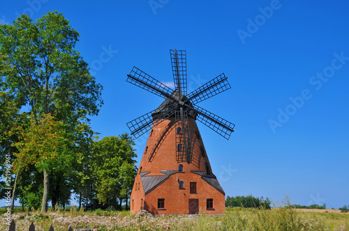 A brick Dutch windmill from the 19th century in Stara Różanka, Warmian-Masurian Voivodeship, Poland