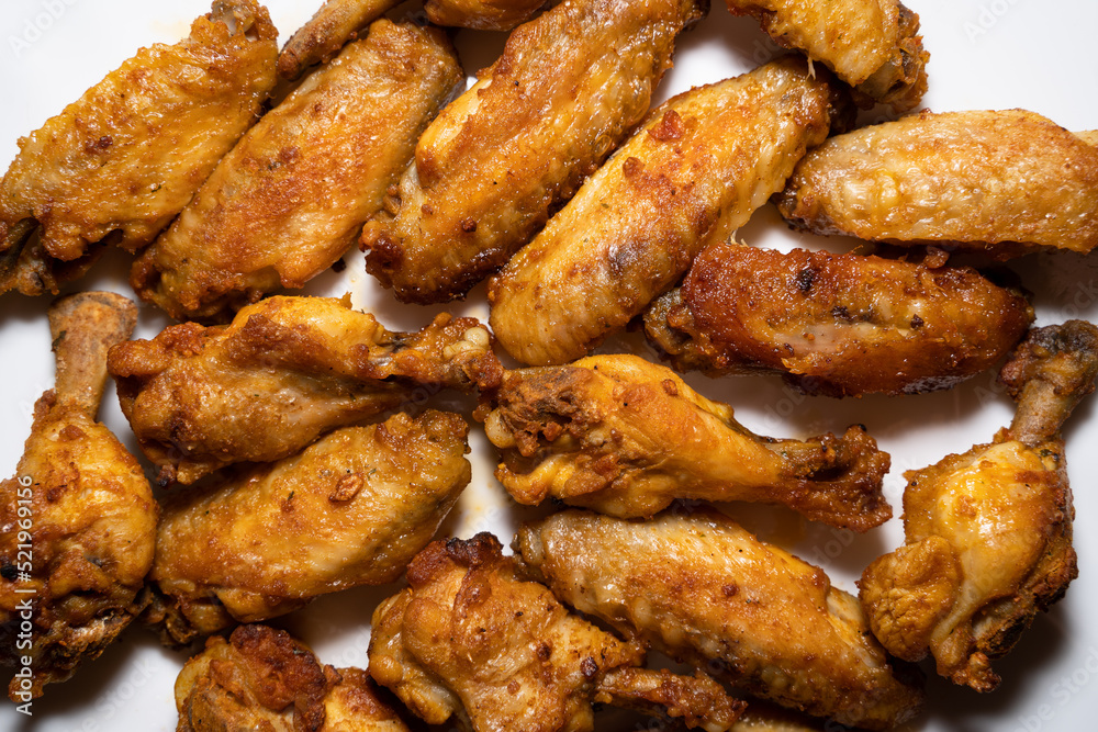 Homemad crispy grilled chicken wings in close up
Homemad crispy grilled chicken wings in close up