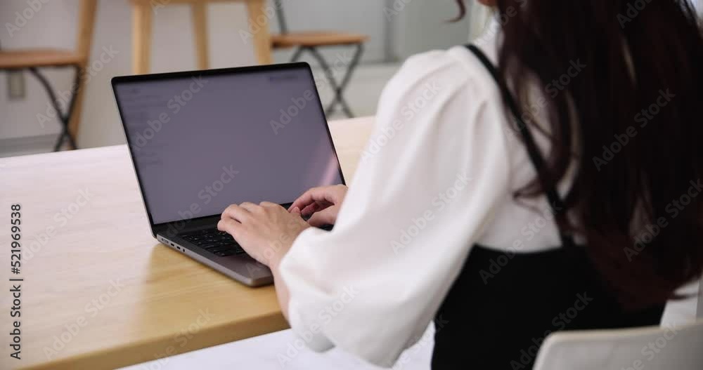 A working Japanese woman typing laptop by remote work in the home office closeup A working Japanese woman typing laptop by remote work in the home office closeup