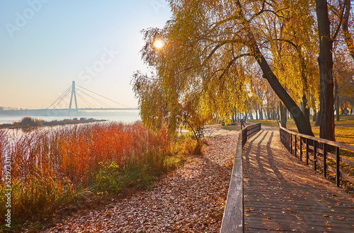 The sunrise in  riverside autumn park, Kyiv, Ukraine photo