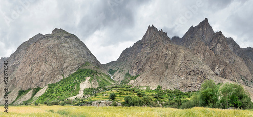 Mountains and green fields in Hushe valley, Gondogoro La trek, Karakoram, Pakistan photo