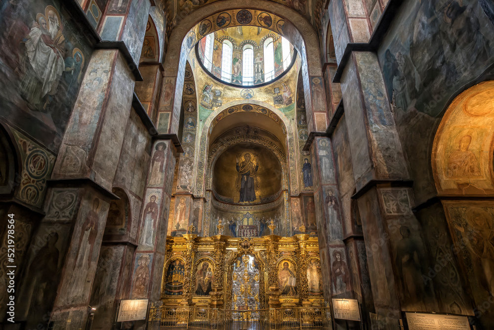 Interior of the St. Sophia Cathedral with mosaic Orans of Kyiv, frescoes on the wall and the golden altar. Kyiv, Ukraine