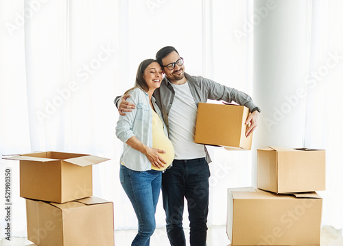 child family box home house moving happy apartment pregnant mother father daughter relocation new property parent pregnancy © Lumos sp