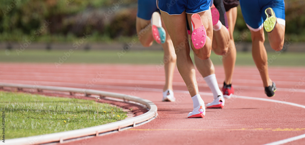 Athletics people running on the track field. Running a race on a track for sports competition and winning