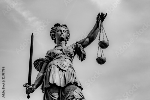 Justitia - Lady Justice . sculpture at the Roemerberg in Frankfurt photo