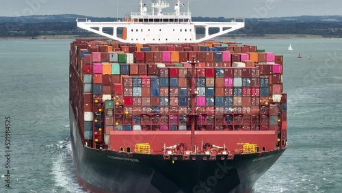 Fully Loaded Container Ship at Sea Transporting Cargo Around the World photo