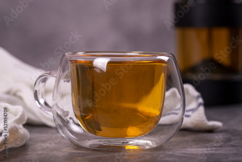 Green tea. Green tea brewed with French press on a dark background. Healthy drinks. Herbal tea concept. close up