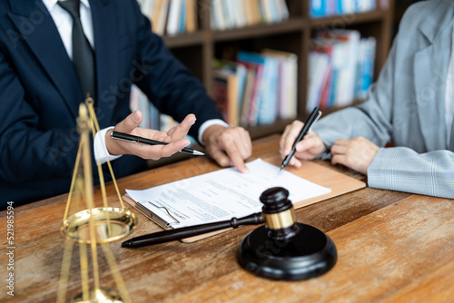 business people and lawyers discussing contract papers sitting at the table. Concepts of law, advice, legal services