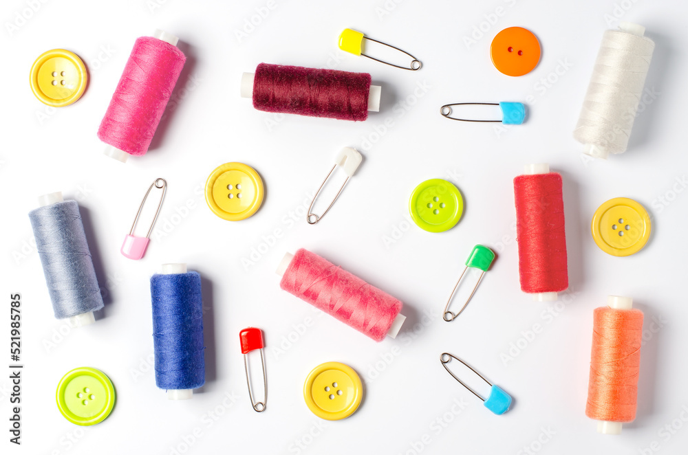 Accessories for sewing on a white background. Closeup. Accessories for sewing on a white background. Closeup.