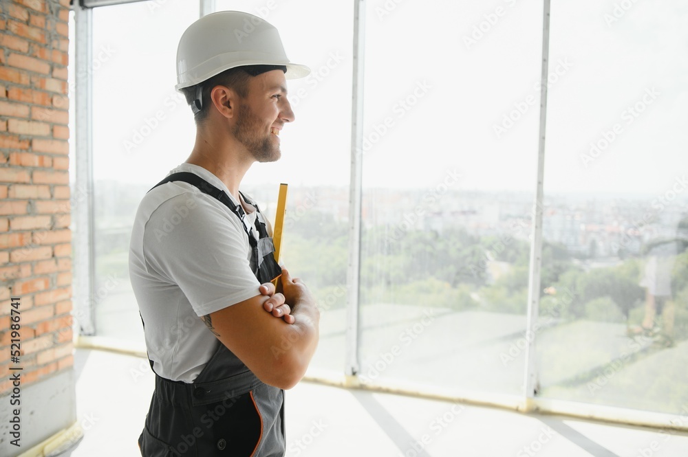 profession, construction and building - male worker or builder in helmet. profession, construction and building - male worker or builder in helmet.