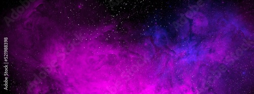 Cosmic background with a blue and pink nebula and stars. Space background with realistic nebula and shining stars. Abstract scientific background with nebulae and stars in space. 