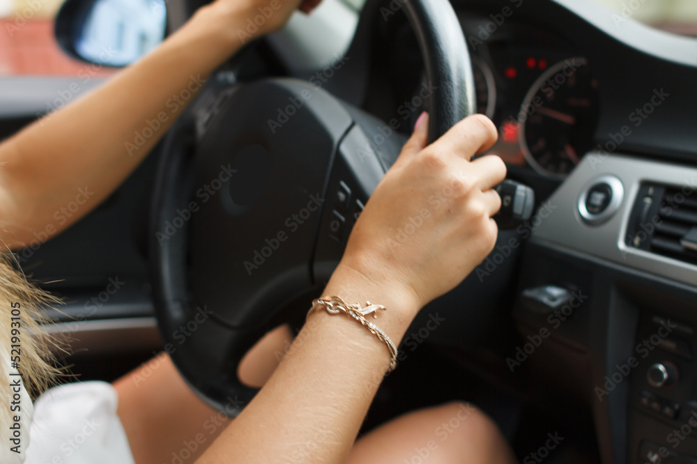 beautiful hands. a woman behind the wheel