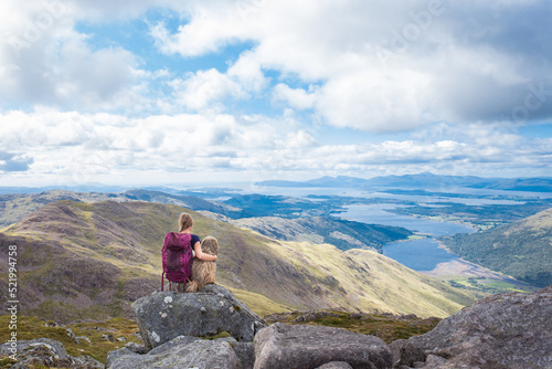 Quadro em tela girl with dog watching Scottish scenery