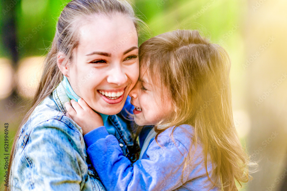 Joyful mother and daughter hug each other. Close-up. Nature, summer forest Joyful mother and daughter hug each other. Close-up. Nature, summer forest