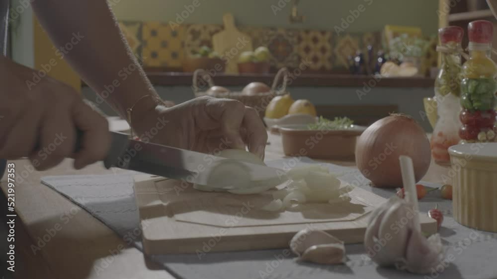 ungraded slicing onion, dicing onion in a wood cutting board, mise en place onion, handheld camera