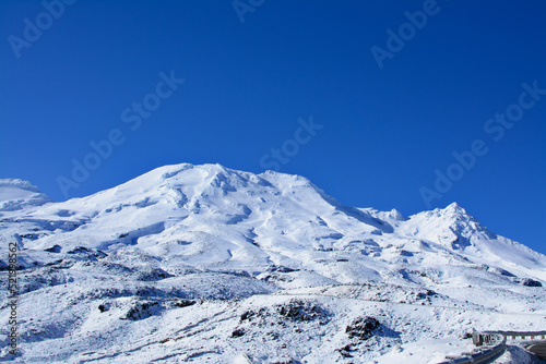 Majestic peaks of Mountain Ruapehu covered with beautiful winter snow. Tongariro National Park  North Island of New Zealand on a bright sunny day