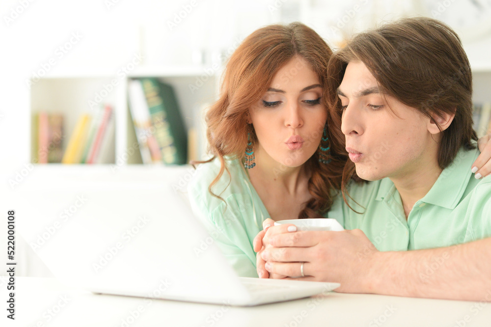 young couple using laptop young couple using laptop