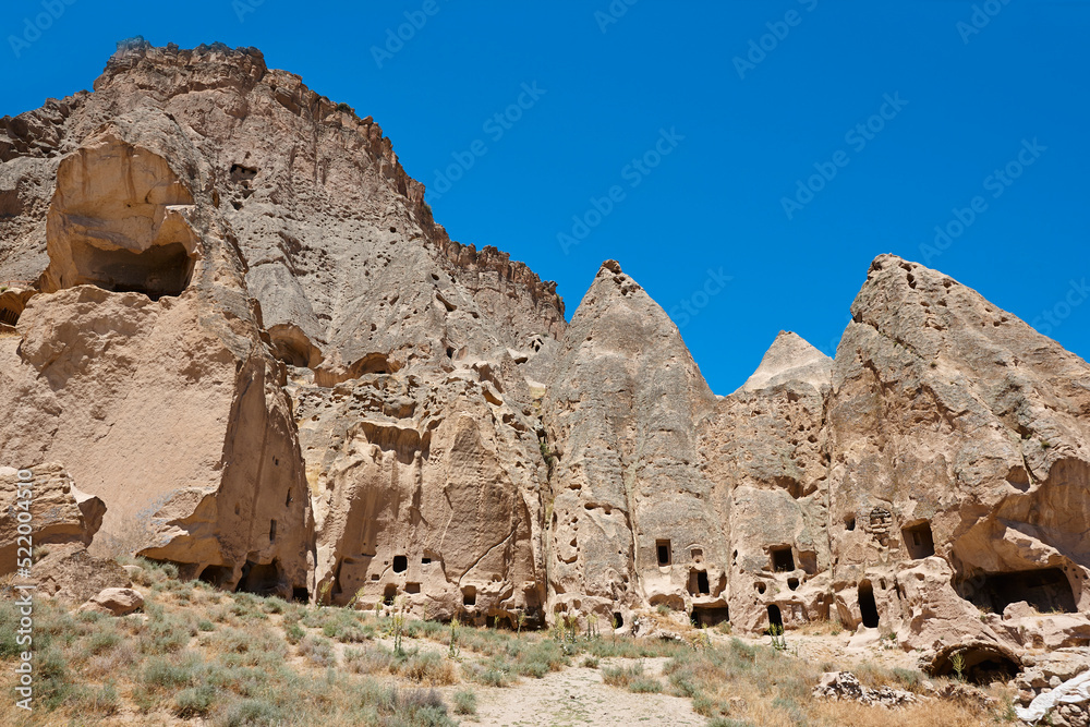 Picturesque houses carved in the rock. Ilhara valley. Cappadocia, Turkey