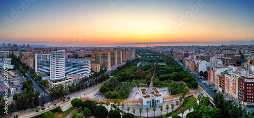Aerial drone view of sunrise over Turia Gardens, a riverbed turned into a park, in Valencia, Spain photo