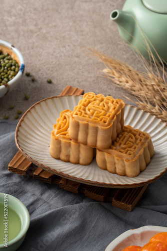 Delicious mung bean moon cake for Mid-Autumn Festival food mooncake on gray table background.