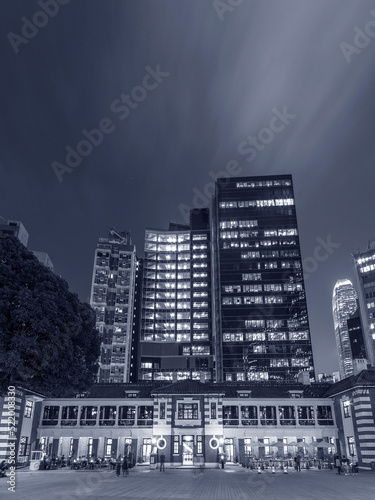 Night scenery of old and modern high rise buildings in Hong Kong city