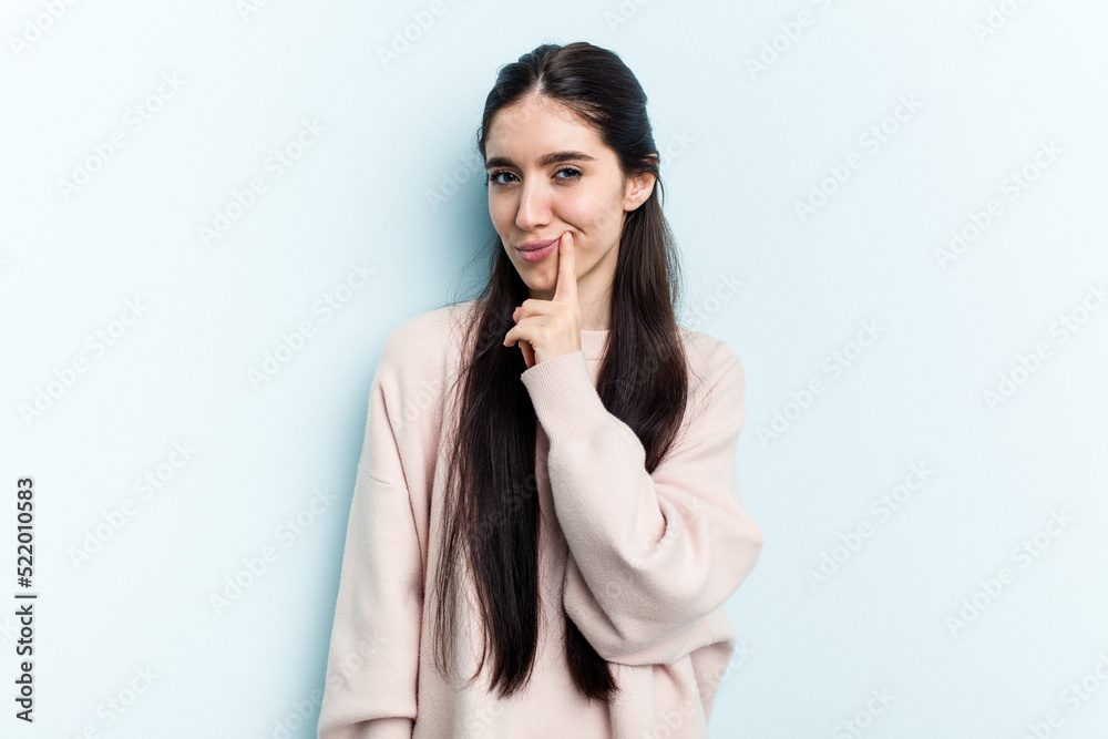 Young caucasian woman isolated on blue background contemplating, planning a strategy, thinking about the way of a business. Young caucasian woman isolated on blue background contemplating, planning a strategy, thinking about the way of a business.
