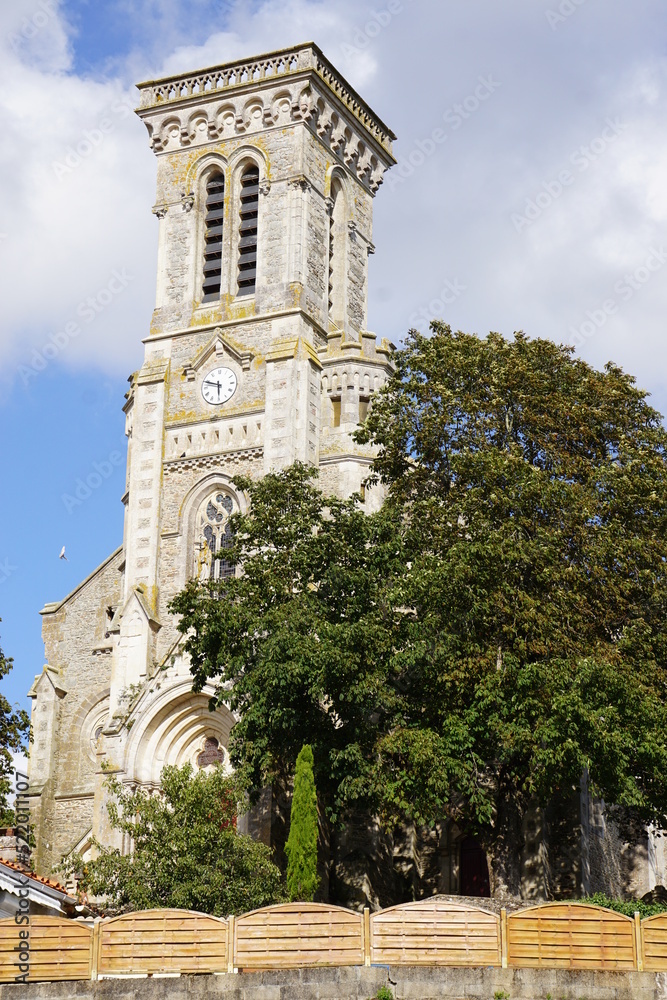 square bell tower of a church in the country in brittany france