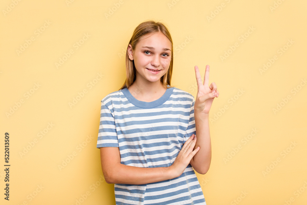Young caucasian girl isolated on yellow background showing number two with fingers. Young caucasian girl isolated on yellow background showing number two with fingers.