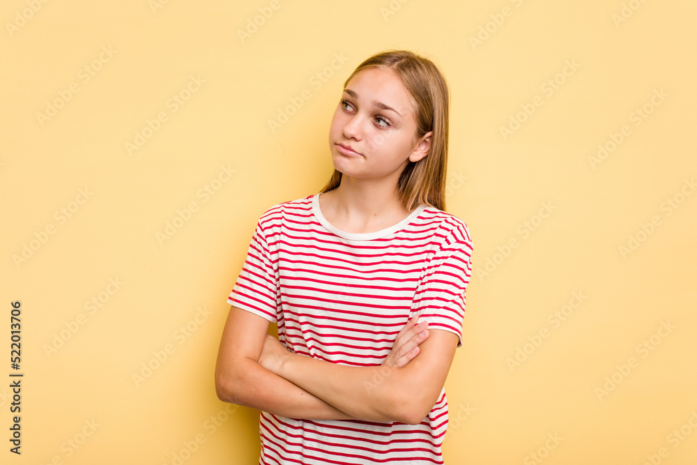 Young caucasian girl isolated on yellow background dreaming of achieving goals and purposes Young caucasian girl isolated on yellow background dreaming of achieving goals and purposes