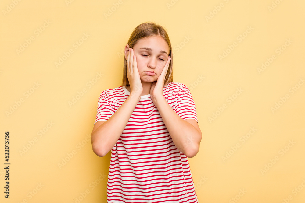 Young caucasian girl isolated on yellow background whining and crying disconsolately. Young caucasian girl isolated on yellow background whining and crying disconsolately.