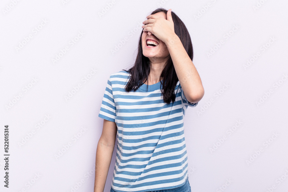 Young caucasian woman isolated on pink background covers eyes with hands, smiles broadly waiting for a surprise. Young caucasian woman isolated on pink background covers eyes with hands, smiles broadly waiting for a surprise.