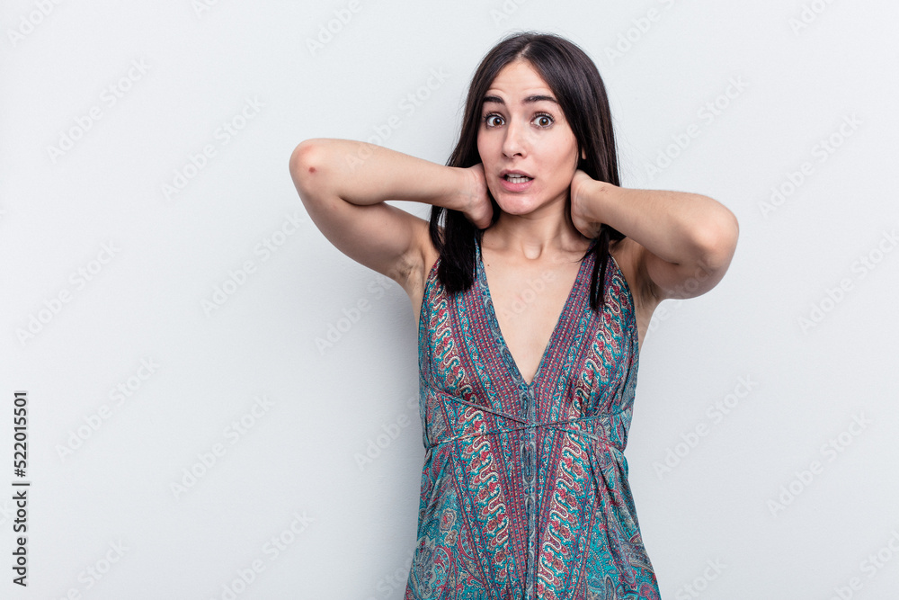 Young caucasian woman isolated on white background touching back of head, thinking and making a choice. Young caucasian woman isolated on white background touching back of head, thinking and making a choice.