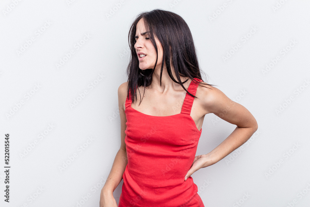 Young caucasian woman isolated on white background suffering a back pain.