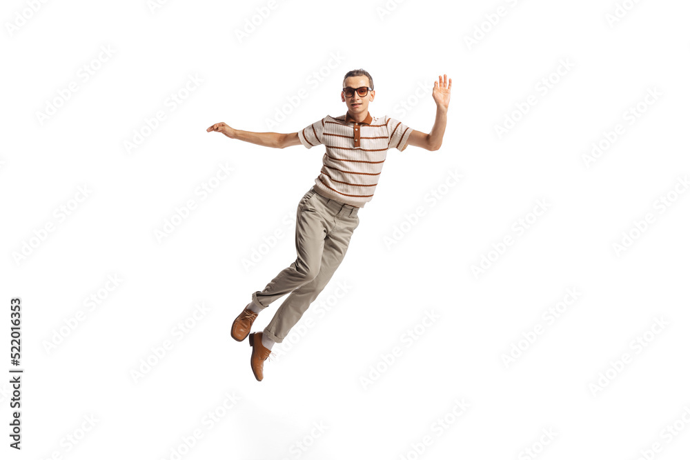 Portrait of stylish cheerful man in retro costume posing in a jump isolated over white studio background Portrait of stylish cheerful man in retro costume posing in a jump isolated over white studio background