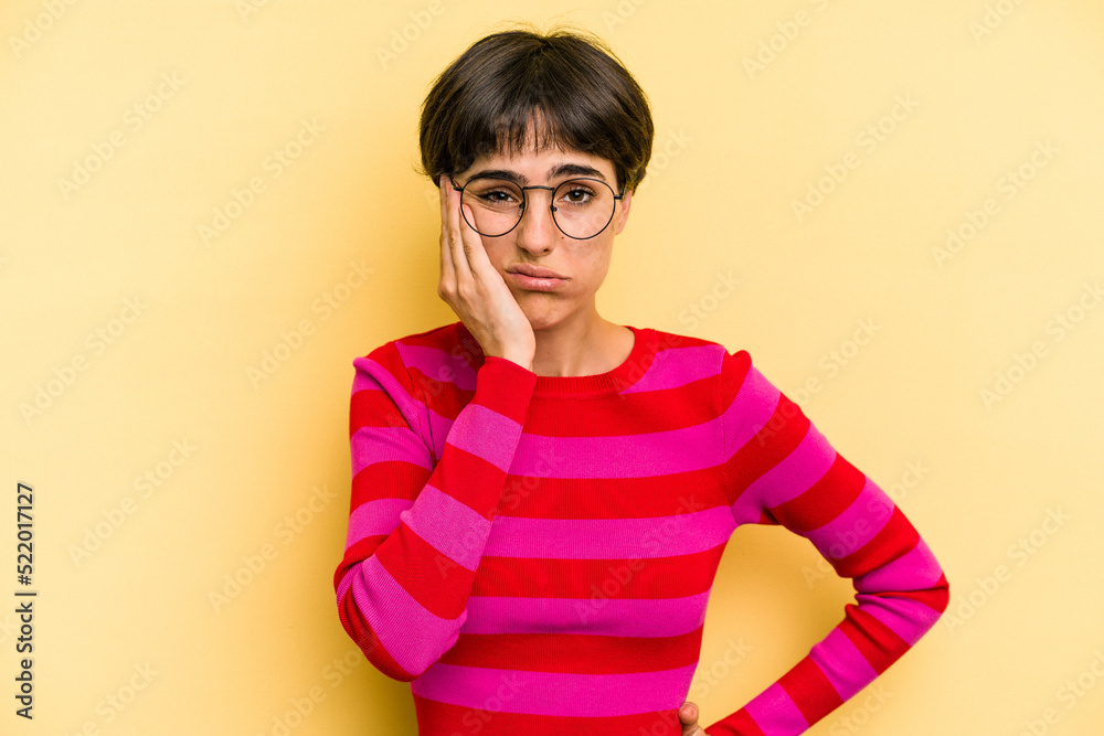 Young caucasian woman with a short hair cut isolated blows cheeks, has tired expression. Facial expression concept. Young caucasian woman with a short hair cut isolated blows cheeks, has tired expression. Facial expression concept.