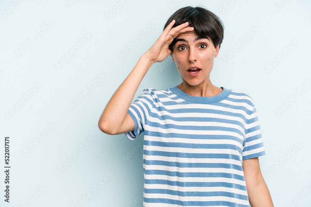 Young caucasian woman with a short hair cut isolated shouts loud, keeps eyes opened and hands tense. Young caucasian woman with a short hair cut isolated shouts loud, keeps eyes opened and hands tense.